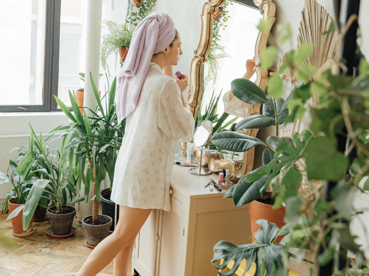 A woman enjoying a restorative bathroom self-care ritual